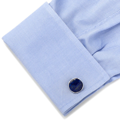 Close-up of sterling silver cufflinks with lapis accents.